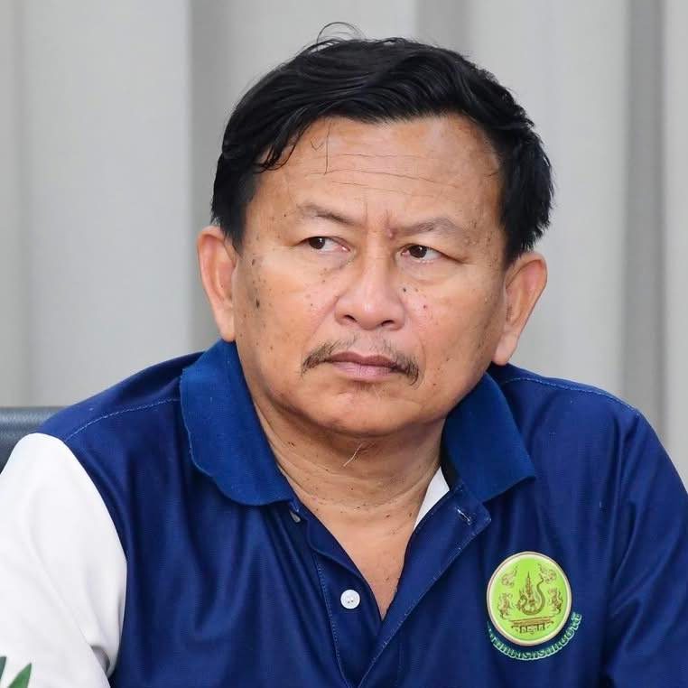 Kanchit Khemchalerm, agroforestry farmer from Chachoengsao, Thailand, with short black hair and a moustache, wearing a navy polo shirt with a green emblem.
