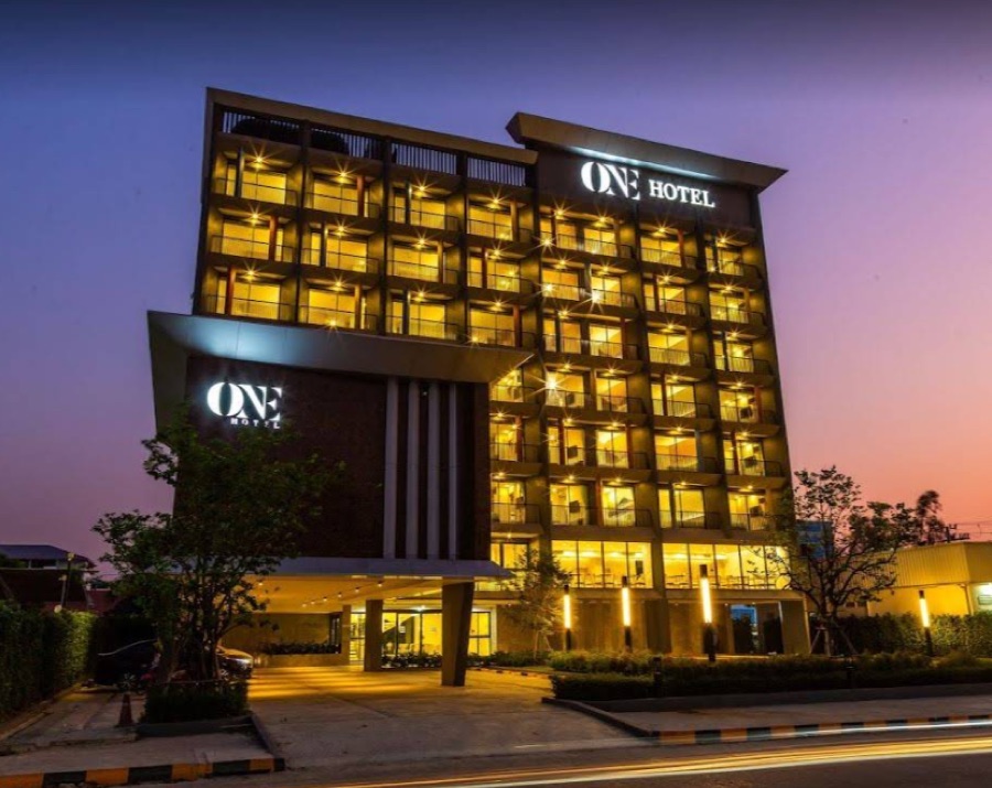 The One Hotel building lit up at dusk, Pathum Thani