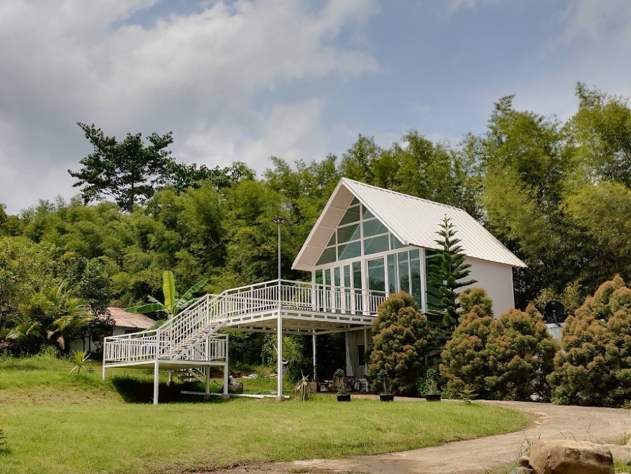 The glass A-frame container house at Suan Saimai, Wang Nam Khiao