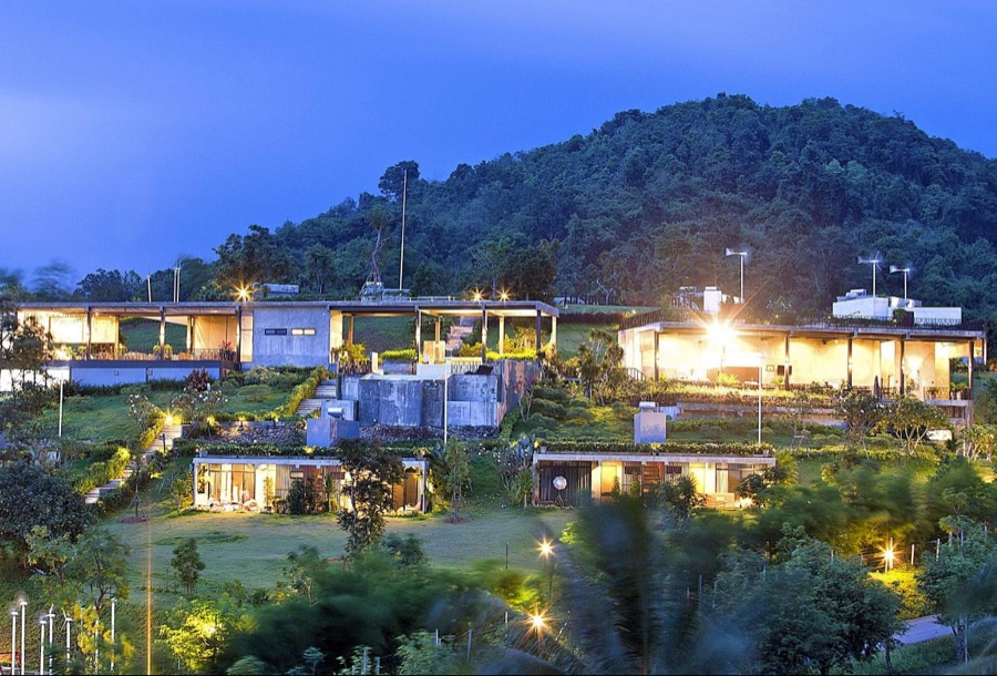 Veravian Resort buildings at dusk below the Khao Yai hills