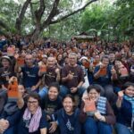 Course participants gathered under large shade trees at the Mab Ueang Agri-Nature Learning Center, a natural-farming and permaculture training centre in Chon Buri, Thailand.