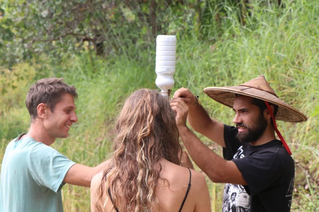 Students assembling an appropriate-technology irrigation device in the gardens at Sahainan