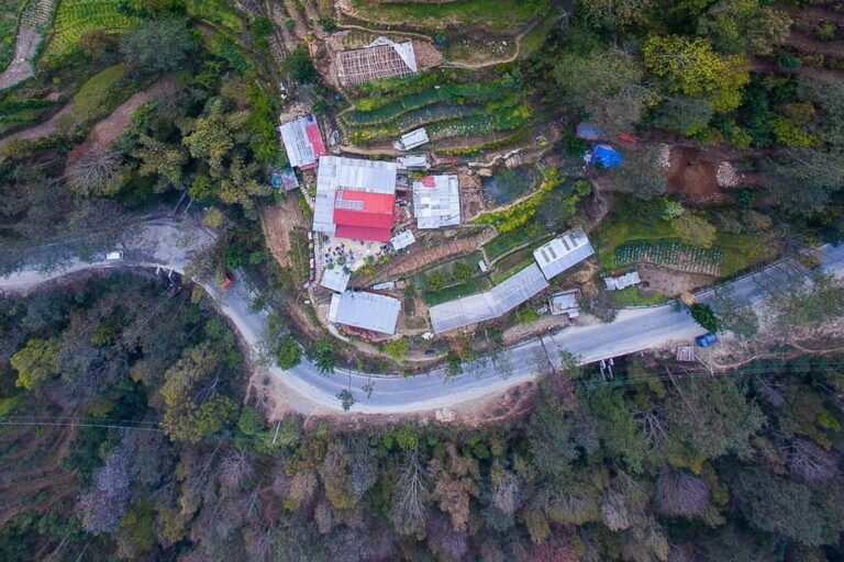 Aerial view of the HASERA farm buildings and terraced fields beside the road at Patalekhet, Nepal.